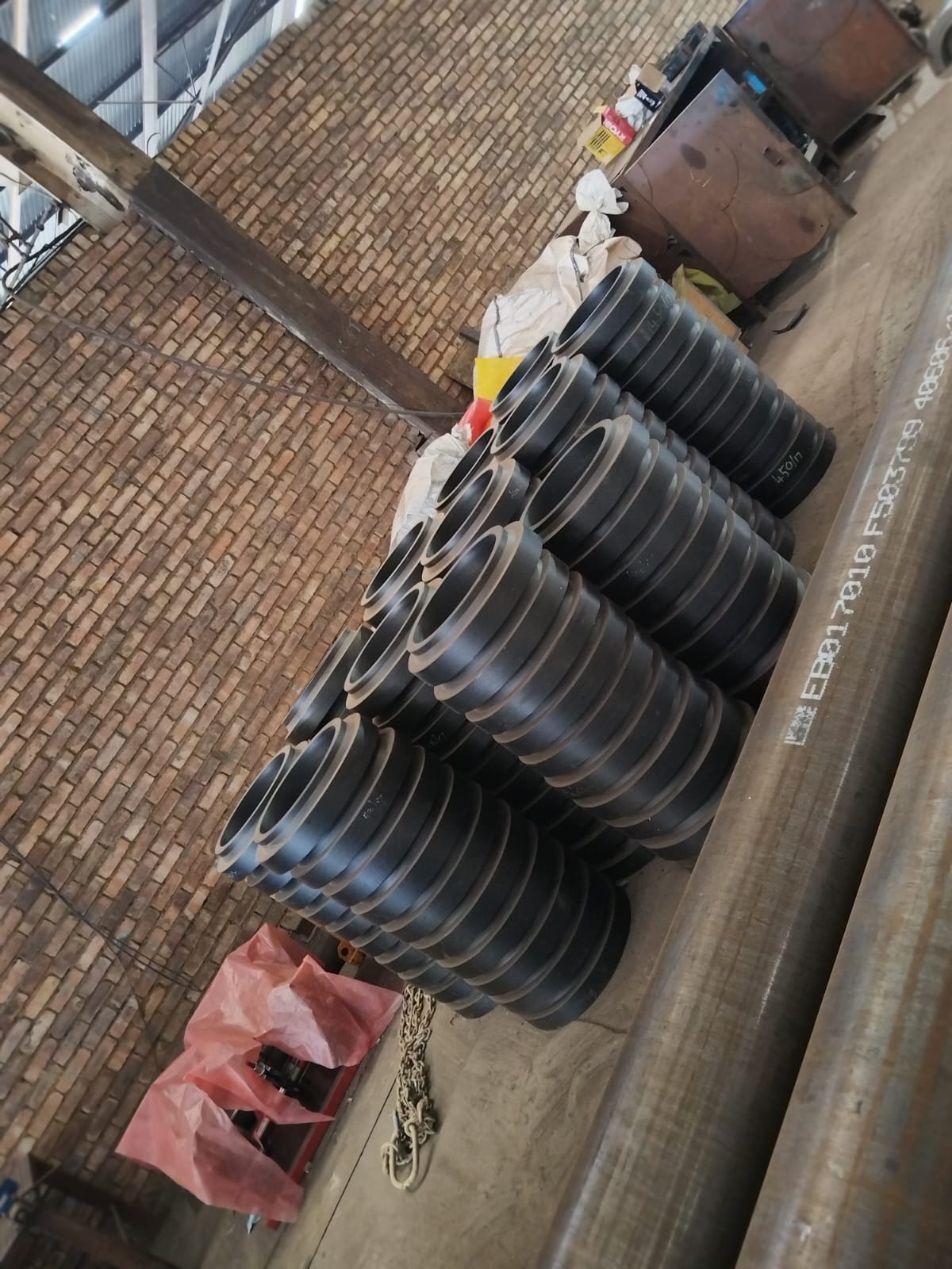 Stacked HDPE stub ends ready for lining steel pipe at Wetpipe